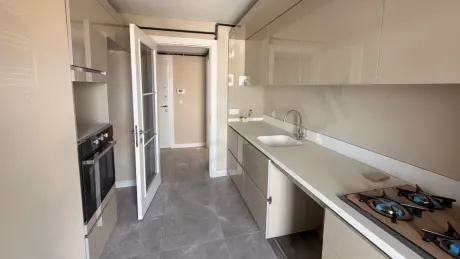 Modern designed, spacious and bright kitchen area.