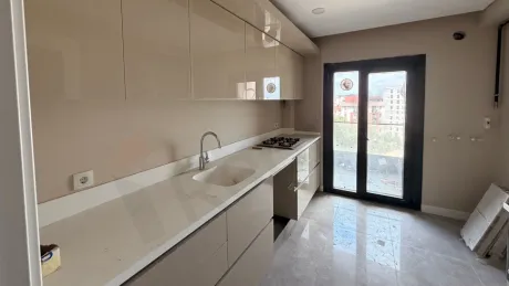 Modern and spacious kitchen area with a bright design.