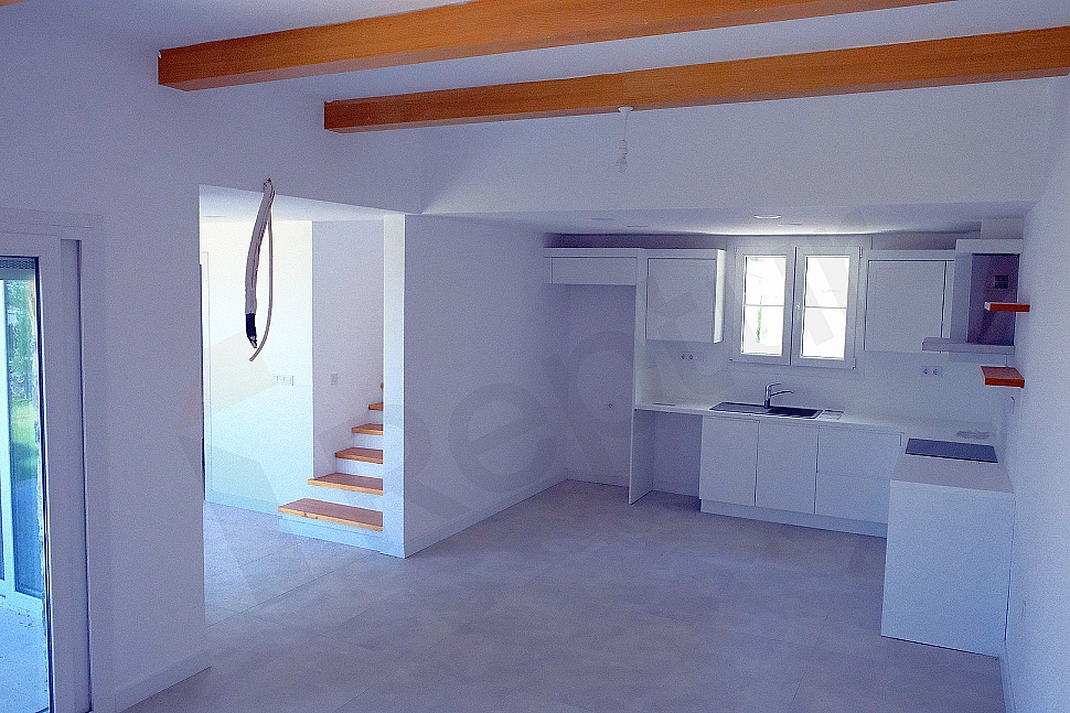 Detail of modern kitchen countertop and cabinets.