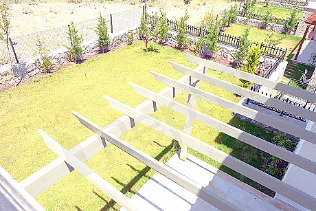 Photo of villa with a spacious garden.