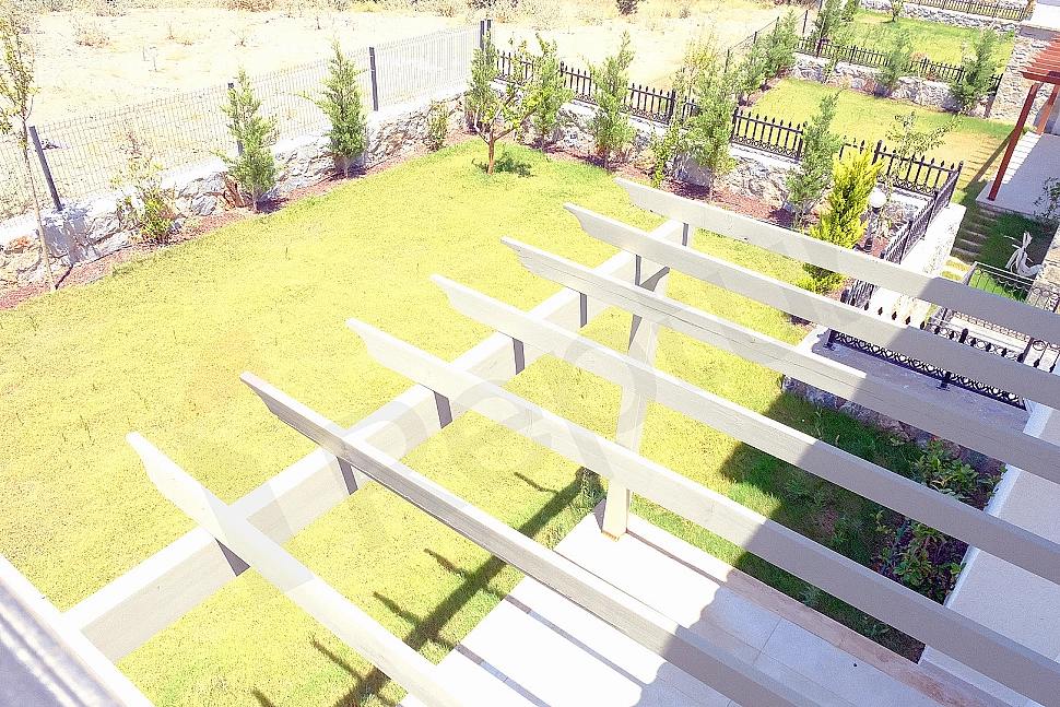 Photo of villa with a spacious garden.