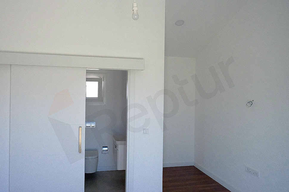 Image of a bright and spacious bedroom.