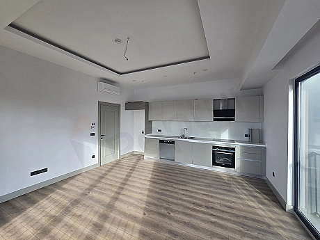 Modern designed unfurnished apartment kitchen.