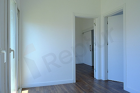 Spacious and bright bedroom.