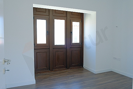Bedroom image. Details of bed, nightstand and lighting.