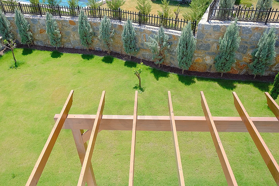 Photo of villa with a large garden.