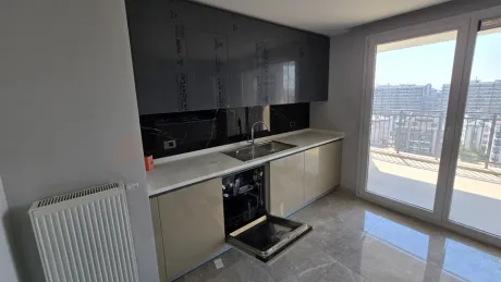 Sleek and spacious kitchen area of a modern apartment.