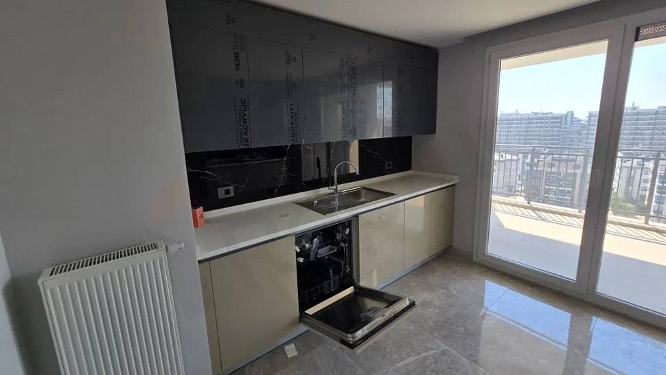 Sleek and spacious kitchen area of a modern apartment.