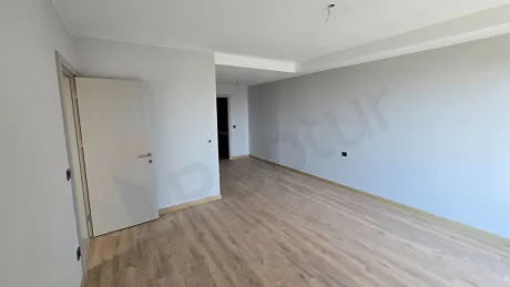 Interior view of a modern and spacious bedroom.