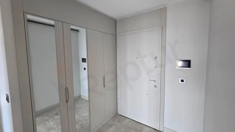 Elegant entrance hall and steel door area of a new modern apartment.