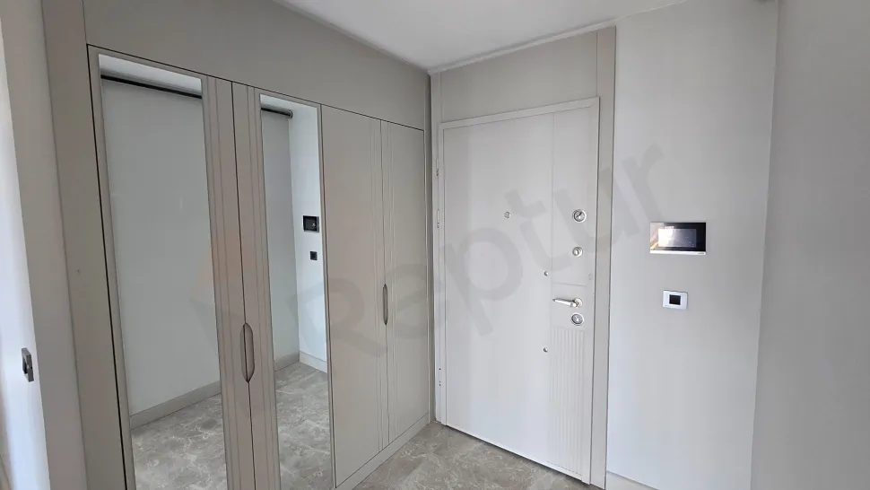 Elegant entrance hall and steel door area of a new modern apartment.
