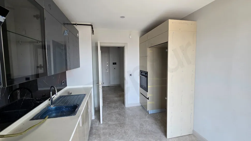 Modern and spacious kitchen area of a 3+1 apartment located in Beylikduzu, Istanbul.