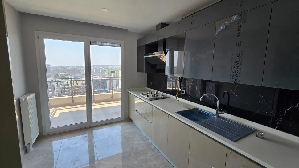 View of a spacious and bright kitchen area with modern design.