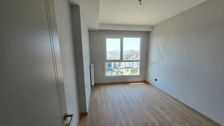 A spacious and modernly designed bedroom interior in a new building.