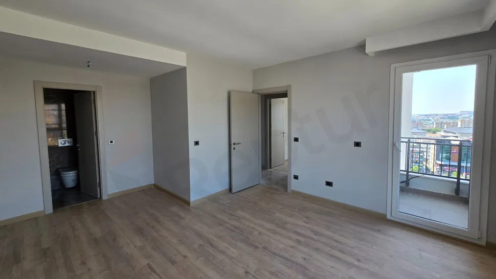 Spacious and modern design bedroom image of a 3+1 apartment for sale in Beylikdüzü.