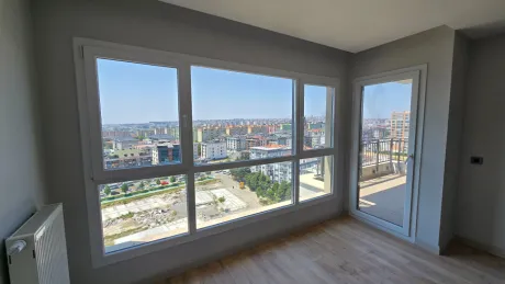 Spacious and modern living room with natural light in a 3+1 luxury apartment in Beylikduzu, Istanbul.