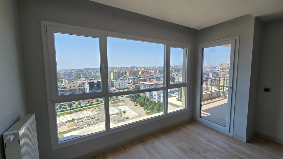 Spacious and modern living room with natural light in a 3+1 luxury apartment in Beylikduzu, Istanbul.