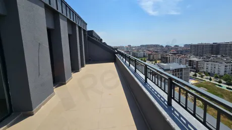 Large and spacious open terrace area with a city view.