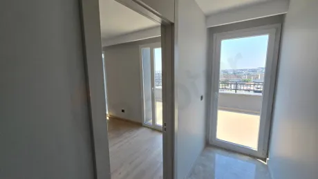 Spacious and modern interior design view of a bedroom.