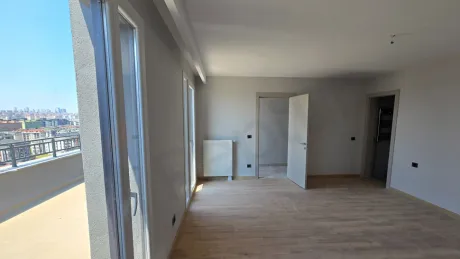View of a spacious and bright bedroom with modern architectural details.