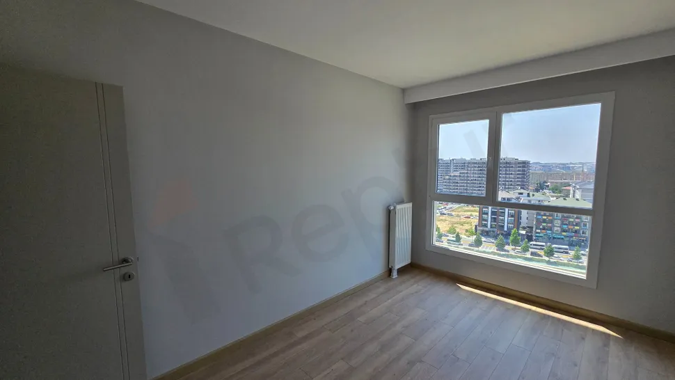 Interior view of a spacious and modern bedroom.