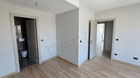 Spacious and bright bedroom area of a modern duplex apartment in Beylikdüzü, Istanbul.