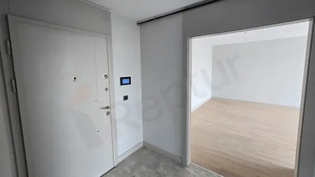 Modern and spacious entrance hallway of a luxury duplex apartment.
