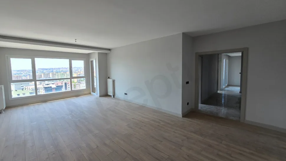 Spacious and bright living room area of a modern duplex apartment with large windows in Beylikdüzü.