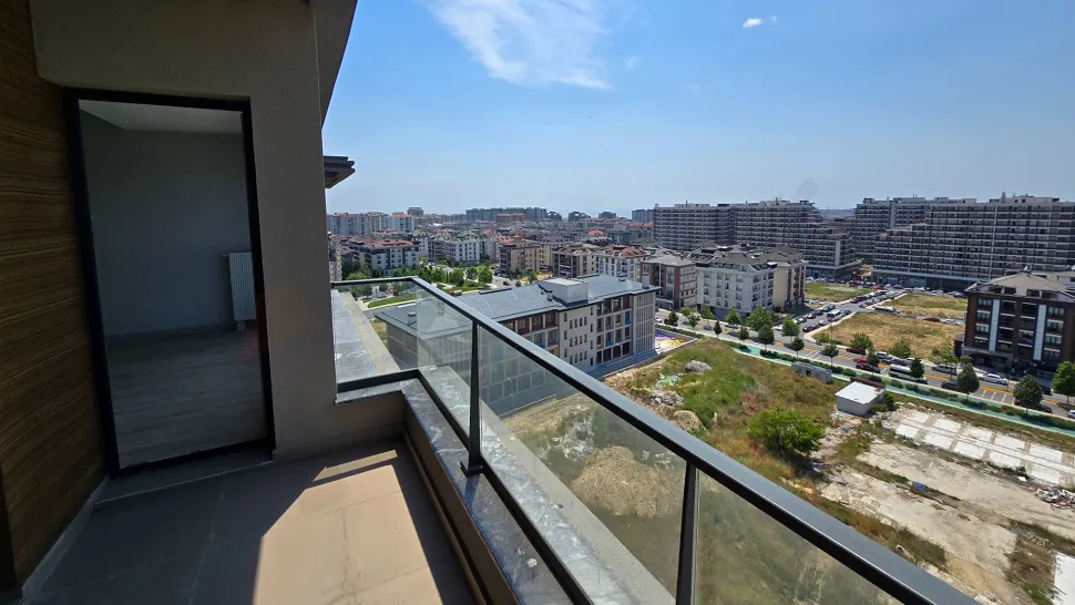 Spacious and modern balcony area with city views.