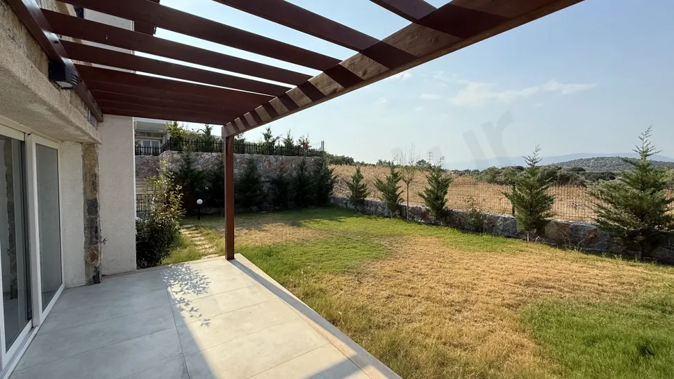 Spacious and modern open-air terrace area of a villa.