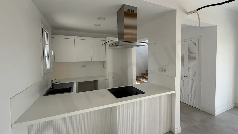 Spacious and bright kitchen area design of a modern villa for sale in Bodrum.