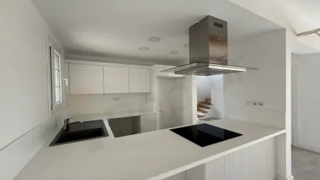 Spacious and bright kitchen area design of a modern villa.