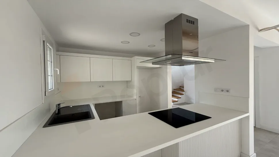 Spacious and bright kitchen area design of a modern villa.
