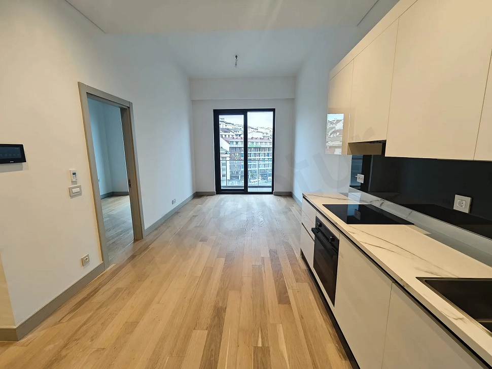 Spacious, sunlit, and modernly designed living room of a 1+1 residence apartment in Sisli.