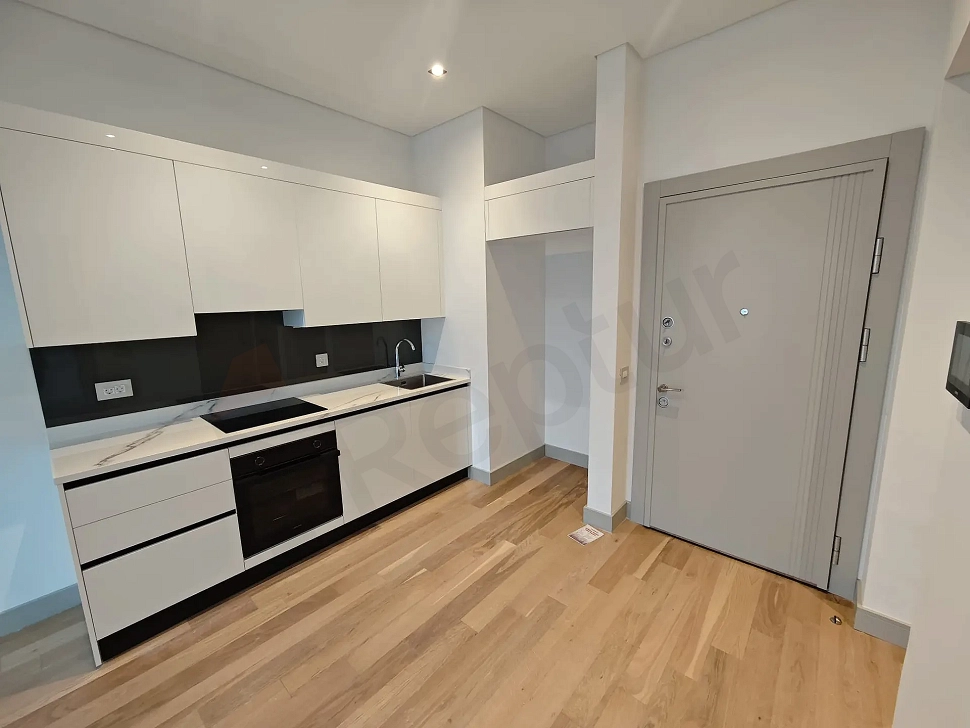 Modernly designed, spacious and bright open-plan kitchen area.