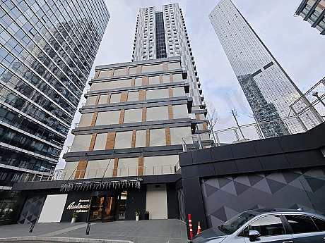 Exterior view of a luxury residence building with modern architecture.