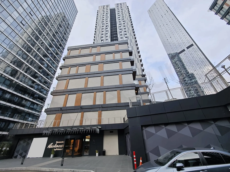 Exterior view of a luxury residence building with modern architecture.