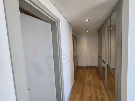 Modern interior wooden staircase design inside the apartment.