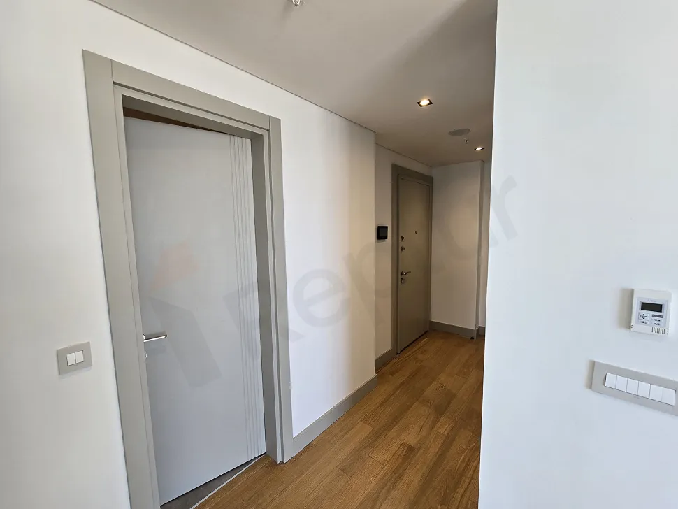 View of a spacious and bright corridor in a modern residential project.