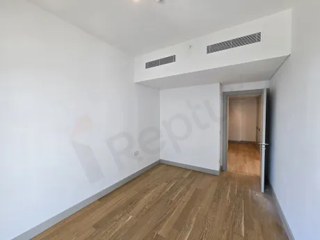 Modern designed, spacious and bright bedroom interior view.