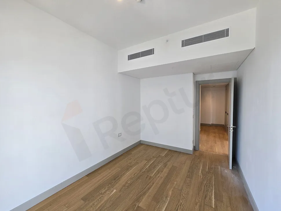 Modern designed, spacious and bright bedroom interior view.
