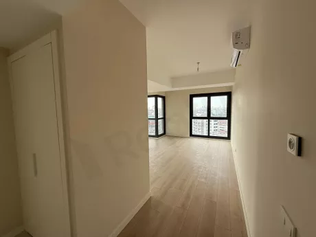 View of a spacious and bright living room filled with natural light.