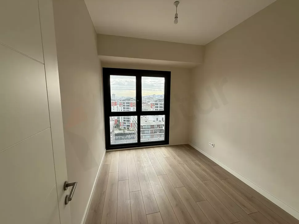 A spacious and bright bedroom area with modern architectural design and natural light.