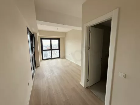 Modernly designed, bright and spacious empty bedroom area with large windows.