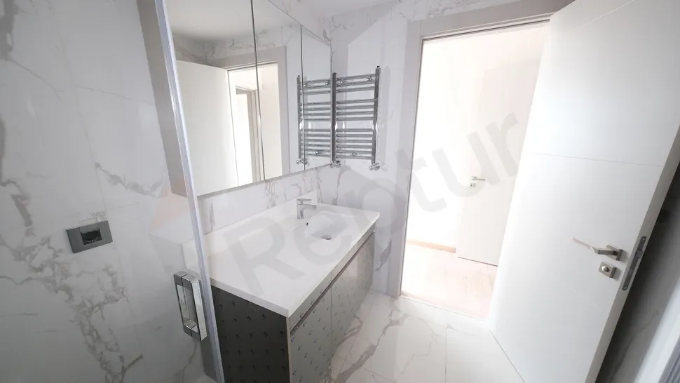 Modern and stylish bathroom design with high-quality ceramic tiles and bathroom fixtures.