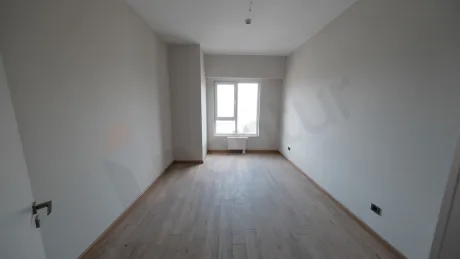 Spacious bedroom area of a modern and bright apartment.
