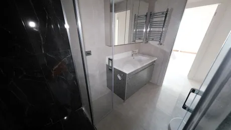 Modern bathroom interior design with stylish ceramic tiles and bathroom fixtures.