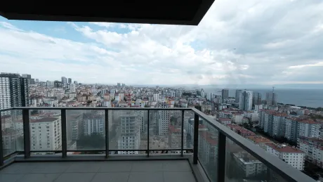 View of a spacious and modern apartment balcony.