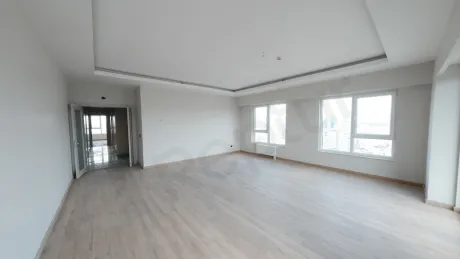 Spacious and bright living room of a modern apartment in Kartal with natural light.