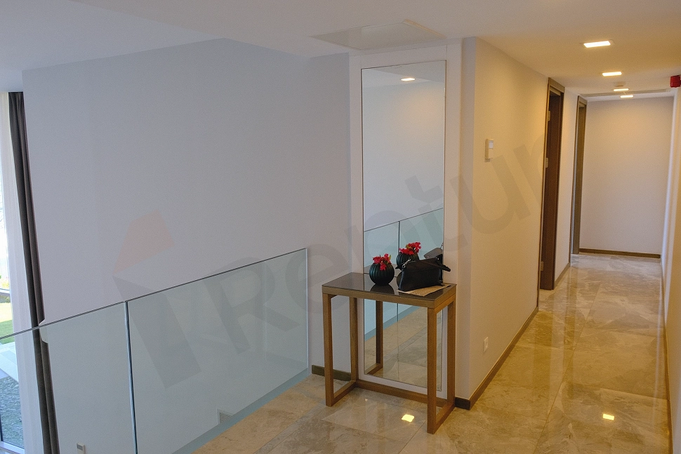 Modern and bright furnished villa corridor with stylish interior design.